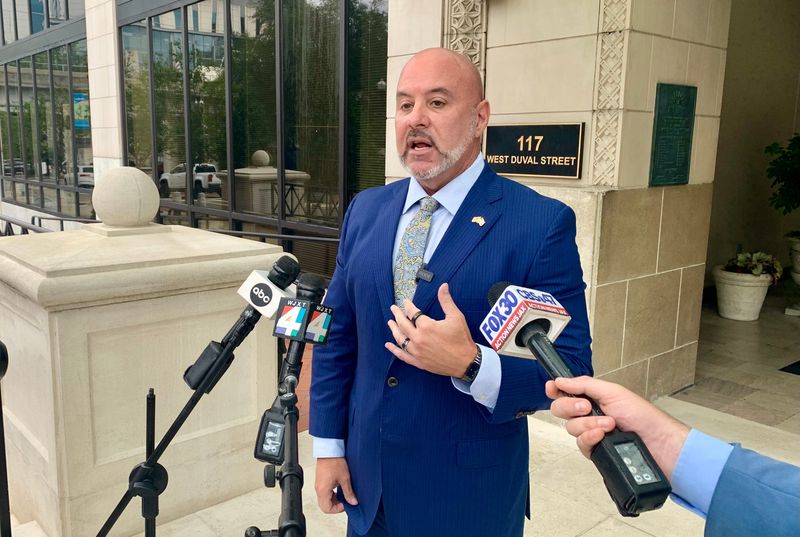 Florida Chief Financial Office Blaise Ingoglia talks to reporters outside Jacksonville City Hall on Aug. 7, 2025. The Florida DOGE team arrived in Jacksonville on Aug. 7 for a two-day visit examining the city's financial records. Ingoglia called for property tax cuts by Jacksonville and other local governments.