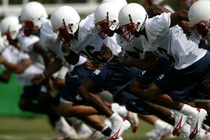 080805 spt fau football 7--Boca Raton--Members of the Florida Atlantic University football team warm up for the first day of football practice at the university practice field in Boca Raton Monday. Staff Photo by Gary Coronado NOT FOR DISTRIBUTION OUTSIDE COX PAPERS. OUT PALM BEACH, BROWARD, MARTIN, ST. LUCIE, INDIAN RIVER AND OKEECHOBEE COUNTIES IN FLORIDA. OUT ORLANDO. OUT TV, OUT MAGAZINES, OUT TABLOIDS, OUT WIDE WORLD, OUT INTERNET USE. NO SALES