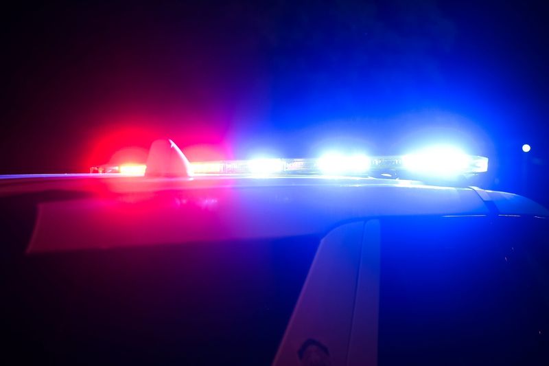 Police sirens are pictured from a distance.