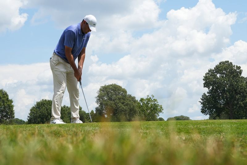 Scottie Scheffler putts on the 17th hole during the second round of the FedEx St. Jude Championship at TPC Southwind in Memphis, Tenn., on August 8, 2025.