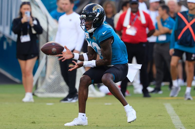 Jacksonville Jaguars wide receiver Travis Hunter (12) catches a pass during an NFL scrimmage event at EverBank Stadium, Friday, Aug. 1, 2025, in Jacksonville, Fla. [Corey Perrine/Florida Times-Union]