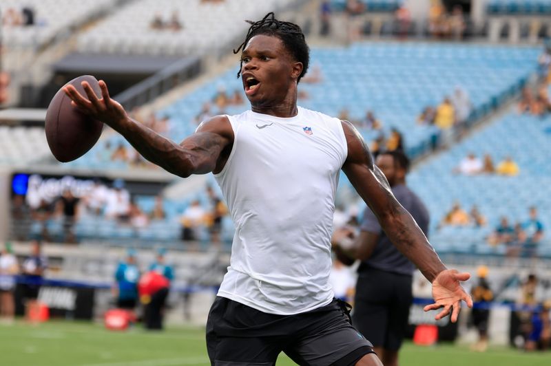 Jacksonville Jaguars wide receiver Travis Hunter (12) can’t haul in a reception before an NFL preseason matchup at EverBank Stadium, Saturday, Aug. 9, 2025 in Jacksonville, Fla. [Corey Perrine/Florida Times-Union]