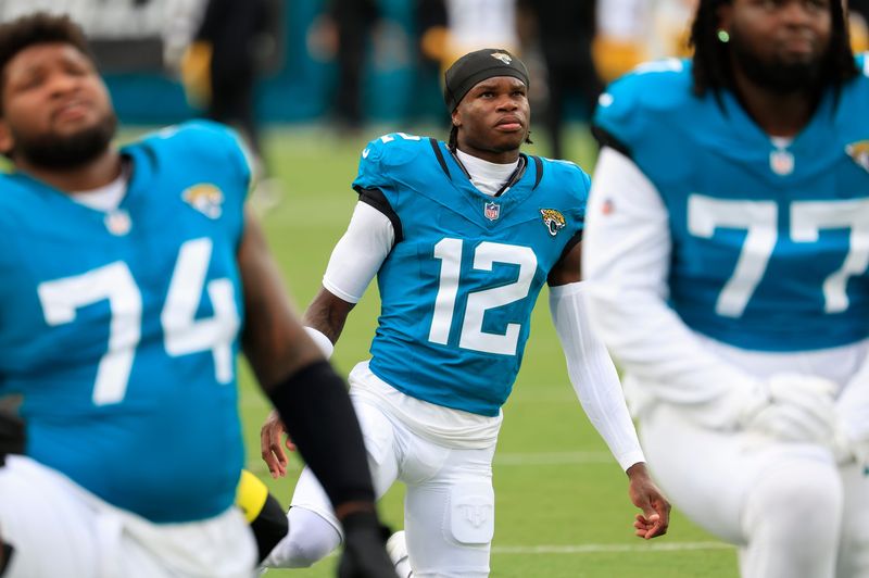 Jacksonville Jaguars wide receiver Travis Hunter (12) warms up before an NFL preseason matchup at EverBank Stadium, Saturday, Aug. 9, 2025 in Jacksonville, Fla. [Corey Perrine/Florida Times-Union]