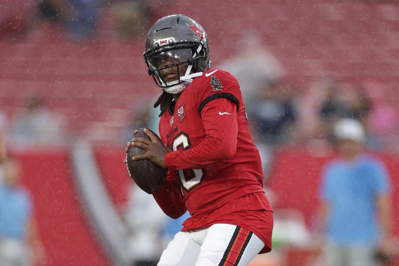 Aug 9, 2025; Tampa, Florida, USA; Tampa Bay Buccaneers quarterback Teddy Bridgewater (16) warms up before a preseason game against the Tennessee Titans at Raymond James Stadium. Mandatory Credit: Nathan Ray Seebeck-Imagn Images