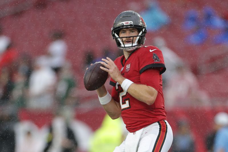 Aug 9, 2025; Tampa, Florida, USA; Tampa Bay Buccaneers quarterback Kyle Trask (2) warms up before a preseason game against the Tennessee Titans at Raymond James Stadium. Mandatory Credit: Nathan Ray Seebeck-Imagn Images
