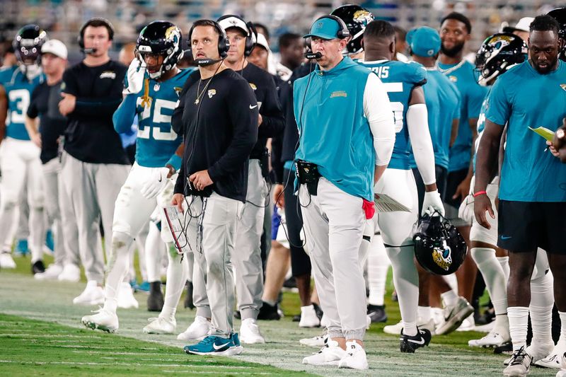 Aug 9, 2025; Jacksonville, Florida, USA; Jacksonville Jaguars defensive coordinator Anthony Campanile stands with head coach Liam Coen on the sidelines during a preseason game against the Pittsburgh Steelers at EverBank Stadium. Mandatory Credit: Travis Register-Imagn Images