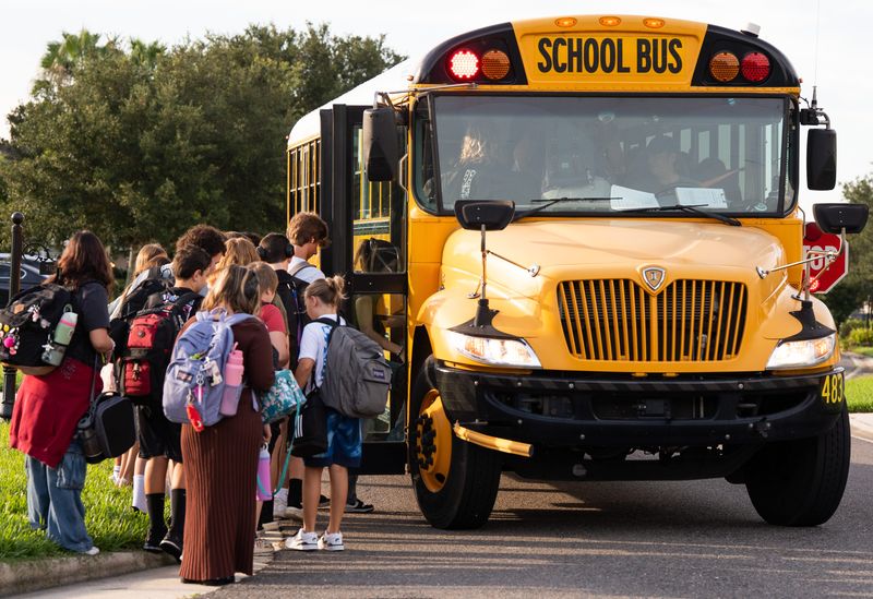 Nassau County students load a bus at Timbercreek Plantation in Nassau County for the first day of school Monday August 11, 2025 in Yulee, Fla. [Doug Engle/Florida Times-Union]