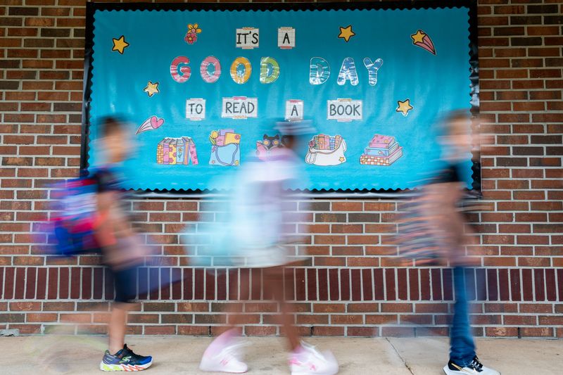 Canopy Oaks Elementary School students make their way to class on the first day of school Monday, Aug. 11, 2025.