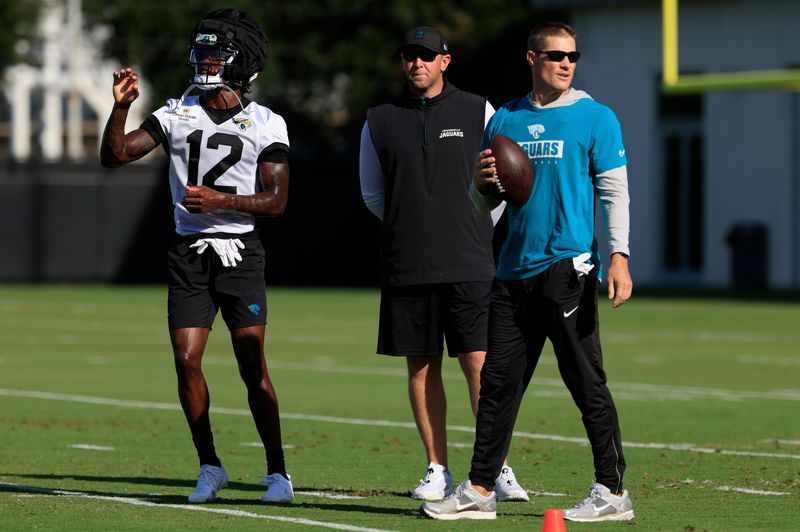 Jacksonville Jaguars wide receiver Travis Hunter (12) stands next to Jacksonville Jaguars head coach Liam Coen during an NFL training camp session at the Miller Electric Center, Monday, Aug. 11, 2025 in Jacksonville, Fla. [Corey Perrine/Florida Times-Union]