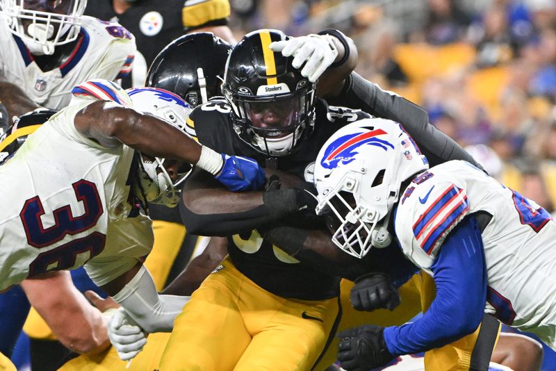 Aug 17, 2024; Pittsburgh, Pennsylvania, USA; Buffalo Bills safety Kendall Williamson (36) and linebacker Deion Jones (45) tackle Pittsburgh Steelers running back Aaron Shampklin (33) during the third quarter at Acrisure Stadium. Mandatory Credit: Barry Reeger-USA TODAY Sports