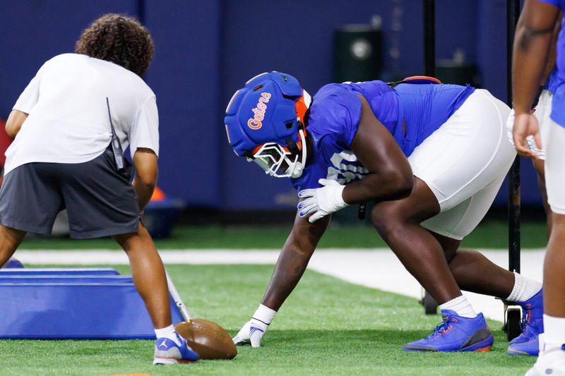 Florida Gators defensive lineman Brendan Bett (90) waits for a drill starts during fall football practice at Sanders Indoor Practice Facility at the University of Florida in Gainesville, FL on Thursday, August 14, 2025. [Matt Pendleton/Gainesville Sun]