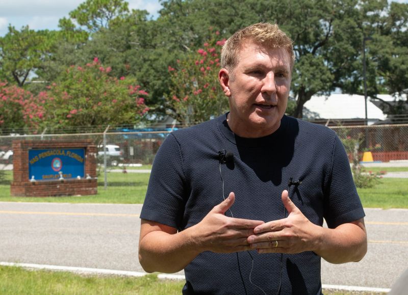 TV personality and pardoned felon Todd Chrisley talks outside the Federal Prison Camp at NAS Pensacola Saufley Field in Pensacola, Florida on Aug. 14, 2025.