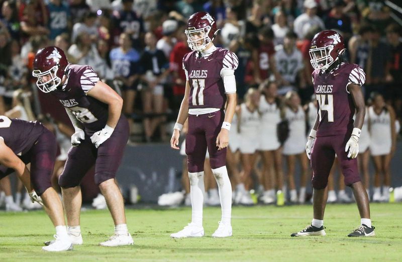 Eagles TE Max Roche, QB Deagan McCoy and RB Jakobe Gilyard get set for their next play during the Niceville - Bay preseason football game at Niceville.