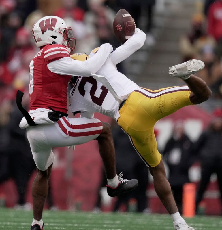 Minnesota defensive back Ethan Robinson (2) breaks a up a pass intended for Wisconsin wide receiver Vinny Anthony II (8) during the fourth quarter of their game at Camp Randall Stadium Friday, November 29, 2024 in Madison, Wisconsin. Minnesota beat Wisconsin 24-7.