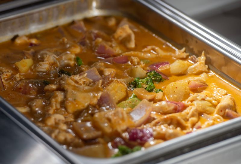 Red Curry Chicken at the new all-you-can-eat buffet at Asia Buffet's soft opening at 4238 W. Fairfield Sunday, Aug. 17, 2025.