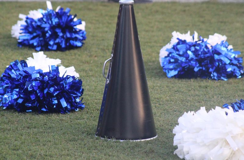 Trinity Christian cheerleading pompoms and a megaphone rest on the field during a high school football kickoff classic against Nease on Aug. 15, 2025. [Clayton Freeman/Florida Times-Union]