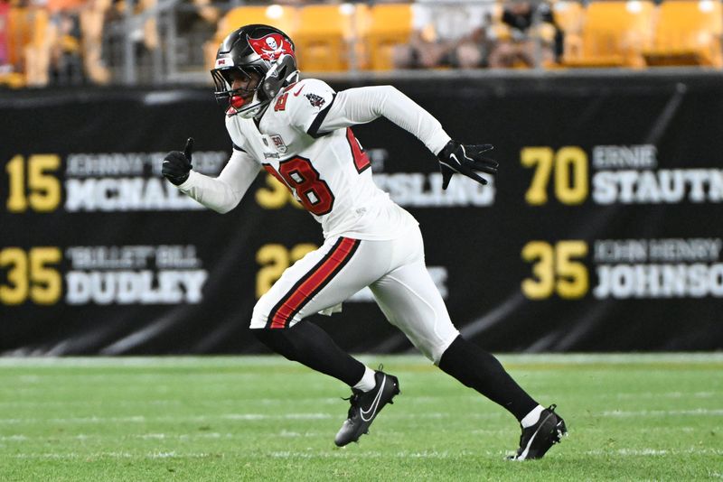Aug 16, 2025; Pittsburgh, Pennsylvania, USA; Tampa Bay Buccaneers safety Shilo Sanders (28) runs against the Pittsburgh Steelers during the second half at Acrisure Stadium. Mandatory Credit: Barry Reeger-Imagn Images