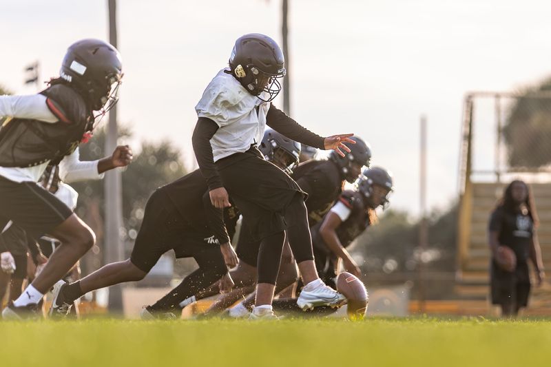 Treasure Coast High School football players run drills during practice, Wednesday, Aug. 13, 2025, in Port St. Lucie. The Titans open their season Aug. 15 at Lake Wales High School.