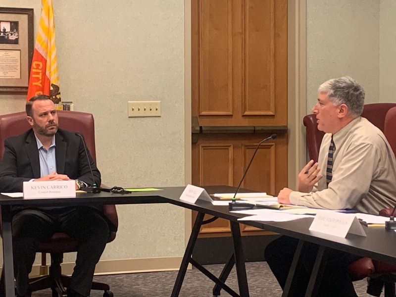 Jacksonville City Council Secretary Jason Teal, at right, and City Council President Kevin Carrico discuss Teal also becoming legislative counsel for City Council during a meeting of the Personnel Committee at Jacksonville City Hall on Aug. 19, 2025.