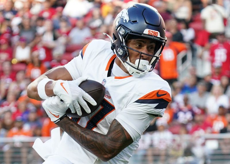 Aug 9, 2025; Santa Clara, California, USA; Denver Broncos wide receiver Devaughn Vele (17) makes a reception in the second quarter against San Francisco 49ers linebacker Nick Martin (45) at Levi's Stadium. Mandatory Credit: David Gonzales-Imagn Images