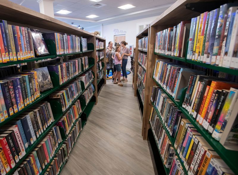 Brownsville residents and other visitors tour the neighborhood's new public library after it opened to the public on August 21, 2025.