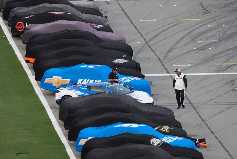 NASCAR Xfinity Series cars sit on pit road before the Wawa 250, Friday, Aug. 22, 2025, at Daytona International Speedway.