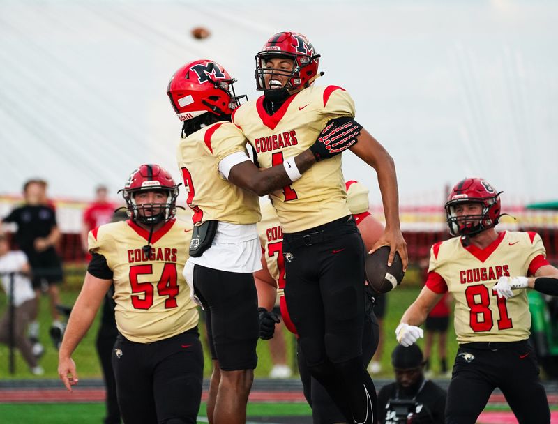 Cardinal Mooney quarterback Davin Davidson (4) celebrates after running for a touchdown during Friday night's game. Cardinal Mooney hosted True North Academy on Friday, Aug. 22, 2025, in Sarasota.