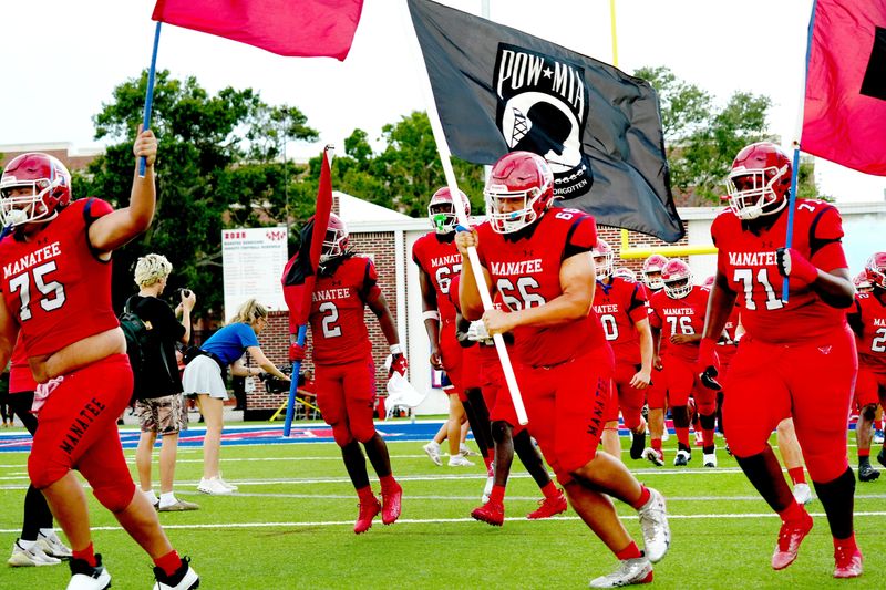 Manatee Players take the field. The Manatee Hurricanes hosted St. John Bosco (California) with a 31-0 lead over Manatee at halftime. After a long lightning delay the rest of the game was canceled at Joe Kinnan Field at Hawkins Stadium on Friday August 22, 2025, in Bradenton, Florida.