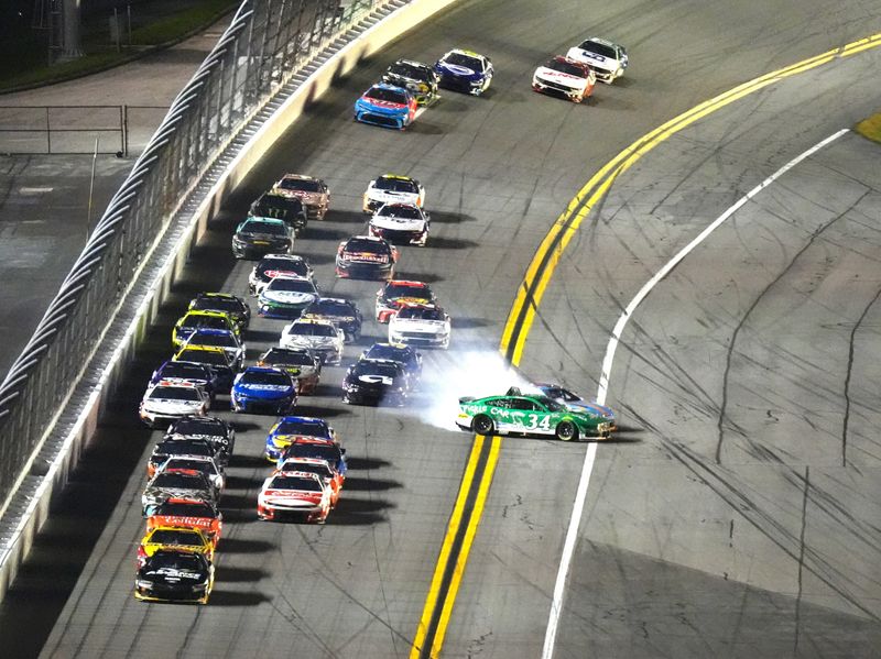 Tyler Reddick (45) and Todd Gilliland (34) crash during the Coke Zero Sugar 400 NASCAR Cup Series race, Saturday, Aug. 23, 2025, at Daytona International Speedway.