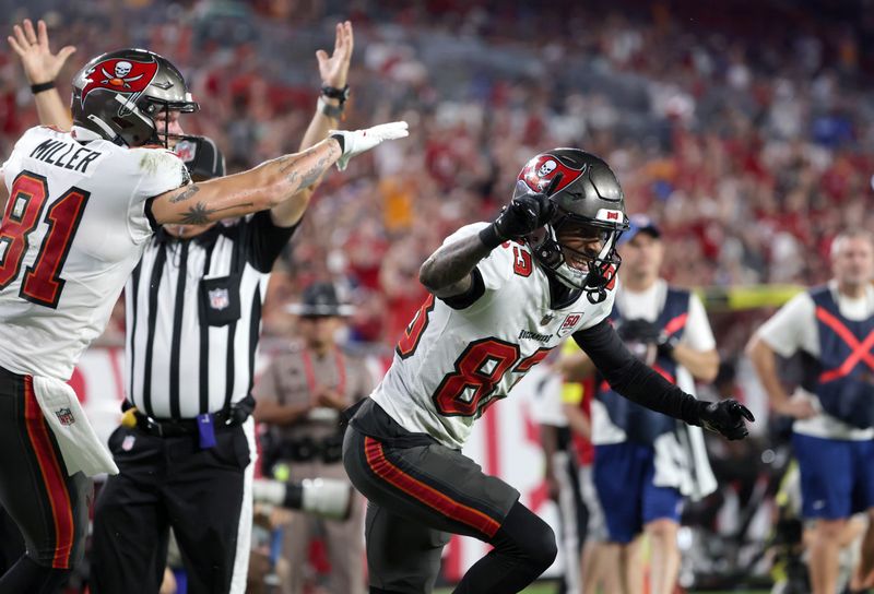 Aug 23, 2025; Tampa, Florida, USA;Tampa Bay Buccaneers wide receiver Tez Johnson (83) celebrates after scoring a touchdown against the Buffalo Bills during the second quarter at Raymond James Stadium. Mandatory Credit: Kim Klement Neitzel-Imagn Images