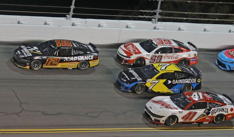 Ryan Blaney (12) wins the Coke Zero Sugar 400 during Saturday night's race at Daytona International Speedway, Aug. 23, 2025.