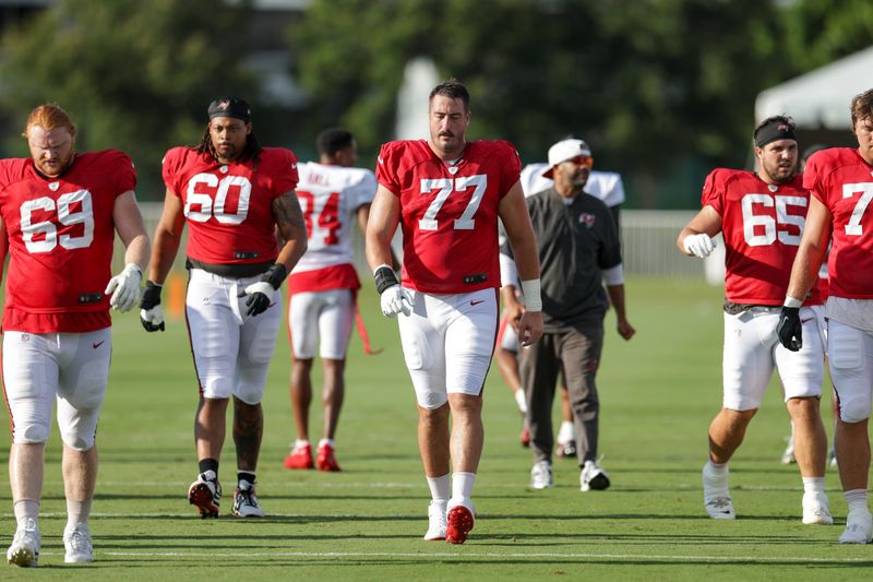 Jul 31, 2025; Tampa, FL, USA; Tampa Bay Buccaneers offensive tackle Charlie Heck (77) participates in training camp at AdventHealth Training Center. Mandatory Credit: Nathan Ray Seebeck-Imagn Images