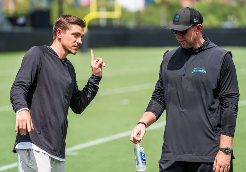 Jacksonville Jaguars general manager James Gladstone, left, talks with Jacksonville Jaguars head coach Liam Coen, right, after the. Jacksonville Jaguarsâ€™ mandatory minicamp Tuesday June 10, 2025 at the Miller Electric Center in Jacksonville, Fla. [Doug Engle/Florida Times-Union]