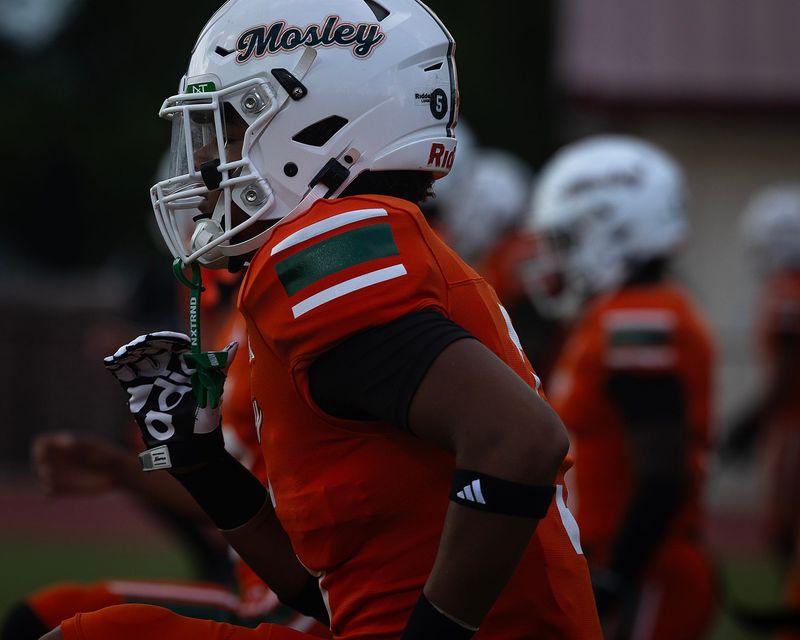Mosley players are seen during warmups at Tommy Oliver Stadium in Panama City, Fla., Aug. 22, 2025. (Tyler Orsburn/News Herald)