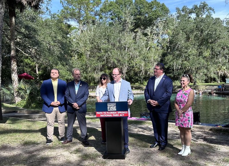 Jonathan Rubin, president and executive director of the nonprofit Clean Earth Initiative, speaks during a press conference Aug. 25, 2025, in the Juniper Springs Recreation Area. Rubin joined Congressman Randy Fine, near right, to advocate for making Ocala National Forest a national park.