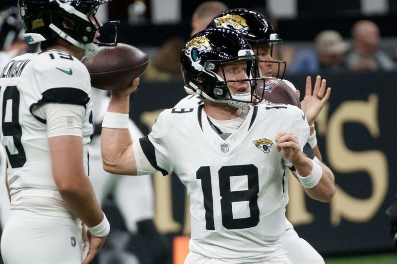 Aug 17, 2025; New Orleans, Louisiana, USA; Jacksonville Jaguars quarterback John Wolford (18) warms up before a game against the New Orleans Saints at Caesars Superdome. Mandatory Credit: Matthew Hinton-Imagn Images