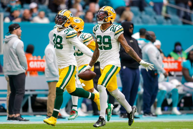 Dec 25, 2022; Miami Gardens, Florida, USA; Green Bay Packers cornerback Rasul Douglas (29) celebrates after intercepting the football during the fourth quarter against the Miami Dolphins at Hard Rock Stadium. Mandatory Credit: Sam Navarro-USA TODAY Sports