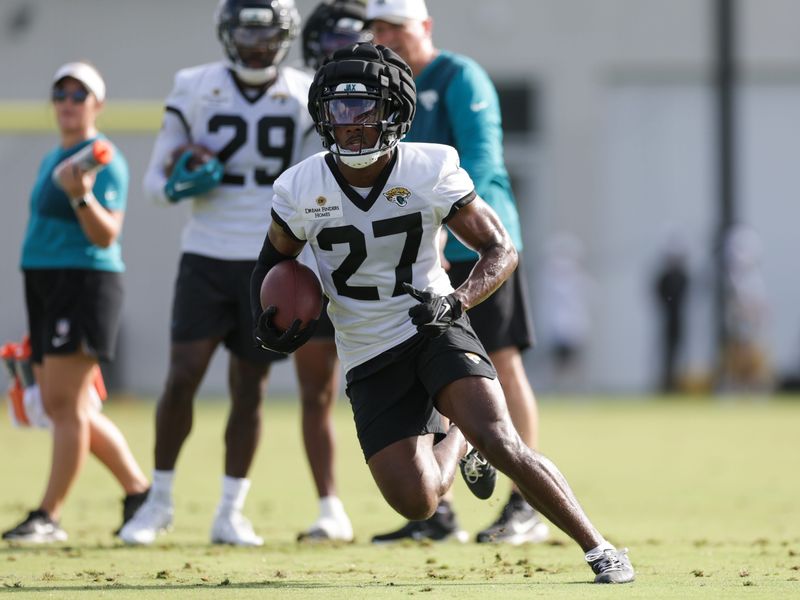 Jul 25, 2025; Jacksonville, FL, USA; Jacksonville Jaguars cornerback Caleb Ransaw (27) participates in training camp at Miller Electric Center. Mandatory Credit: Nathan Ray Seebeck-Imagn Images