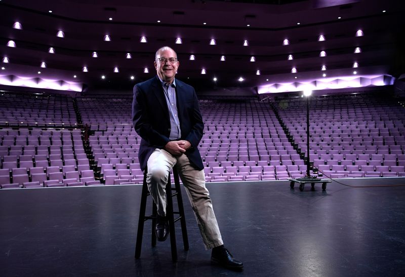 Jay Handelman, Sarasota Herald-Tribune Arts Editor and Theater Critic, sits on stage at the Van Wezel Performing Arts Center in Sarasota, Florida before retiring from the newspaper after nearly 41 years.