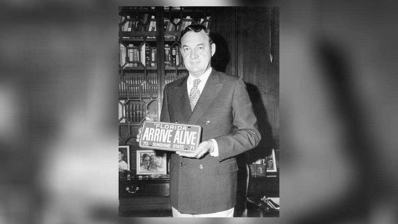 Former Gov. Claude Kirk displays a vanity automobile license plate in 1970.