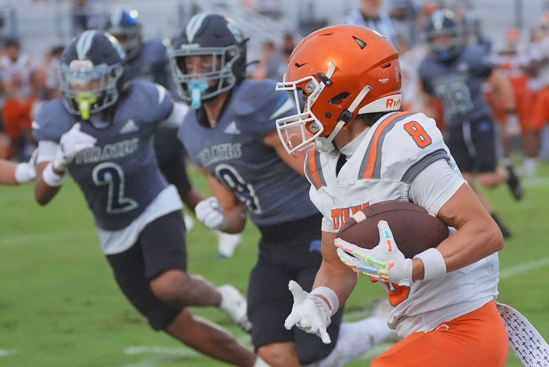 University High's Magnum Rojas #8 moves down field as Matanzas High gives chase, Friday August 29, 2025 in Palm Coast.