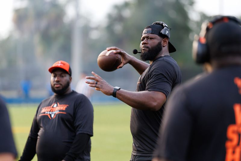 Hawthorne Hornets head coach Cornelius Ingram throws the ball during a timeout against the Newberry Panthers during the first half at Newberry High School in Newberry, FL on Friday, August 29, 2025. [Matt Pendleton/Gainesville Sun]