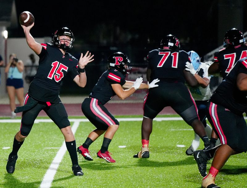 Back to pass Palmetto's quarterback Matthew Hennessey (#15). The Palmetto Tigers with a 42-20 win over the Newsome Wolves at Harllee Stadium Friday night August 29, 2025, in Palmetto.