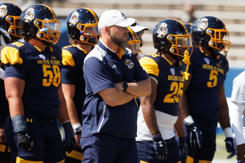 Kent State interim coach Mark Carney watches from the sideline during the season opener against Merrimack College on Aug. 30, 2025, in Kent.