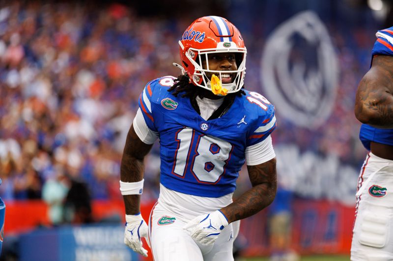 Aug 30, 2025; Gainesville, Florida, USA; Florida Gators defensive back Bryce Thornton (18) smiles after scoring a touchdown against the Long Island Sharks during the first half at Ben Hill Griffin Stadium. Mandatory Credit: Matt Pendleton-Imagn Images