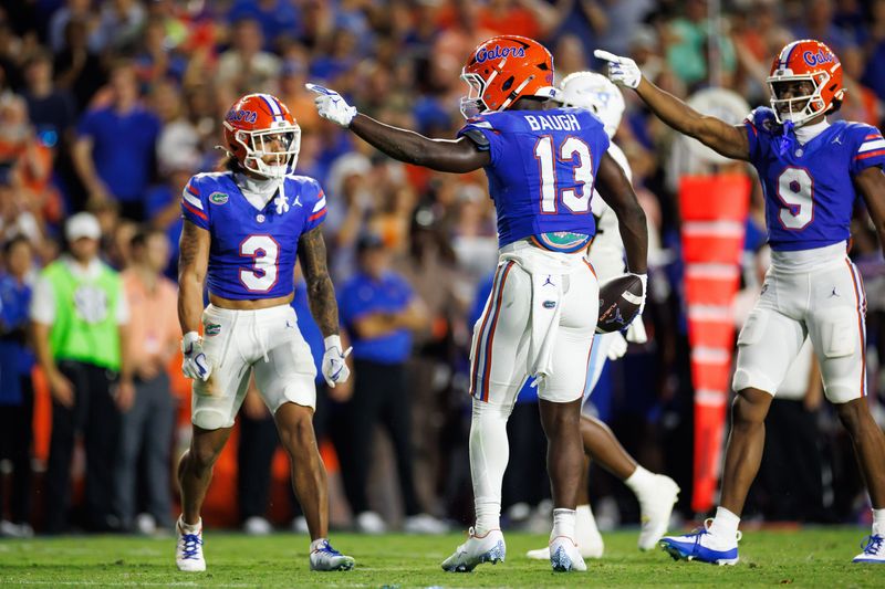 Aug 30, 2025; Gainesville, Florida, USA; Florida Gators running back Jadan Baugh (13) and Florida Gators wide receiver J. Michael Sturdivant (9) gesture after a run against the Long Island Sharks during the first half at Ben Hill Griffin Stadium. Mandatory Credit: Matt Pendleton-Imagn Images