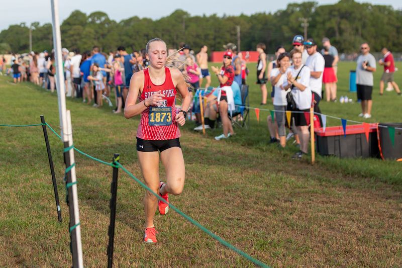 South Fork’s Emerson Brinn (1873) crosses the finish line in 19:32.70 during a high school cross country meet at the Indian River Fairgrounds XC Invitational on Aug. 30, 2025. Seventeen girls teams and 20 boys teams from area high schools competed.