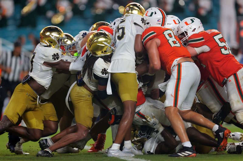 Miami Hurricanes running back CharMar Brown (6) scores a touchdown Aug. 31, 2025, against the Notre Dame Fighting Irish during the third quarter at Hard Rock Stadium in Miami Gardens, Florida. Mandatory Credit: Sam Navarro-Imagn Images
