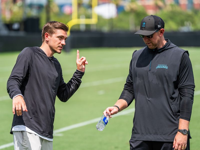 Jacksonville Jaguars general manager James Gladstone, left, talks with Jacksonville Jaguars head coach Liam Coen, right, after the. Jacksonville Jaguarsâ€™ mandatory minicamp Tuesday June 10, 2025 at the Miller Electric Center in Jacksonville, Fla. [Doug Engle/Florida Times-Union]