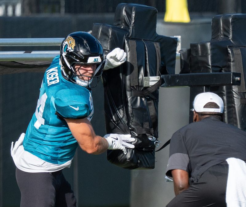 Jacksonville Jaguars linebacker Jack Kiser (54) hits the sled during the Jaguars 14th NFL training camp session at Miller Electric Center Tuesday August 12, 2025 in Jacksonville, Fla. The Jaguars travel to New Orleans to play the Saints this Sunday in their second preseason game. [Doug Engle/Florida Times-Union]
